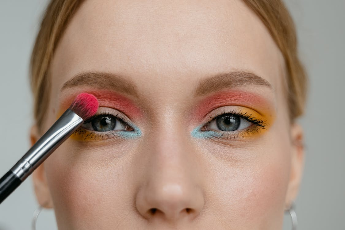 person applying eyeshadow