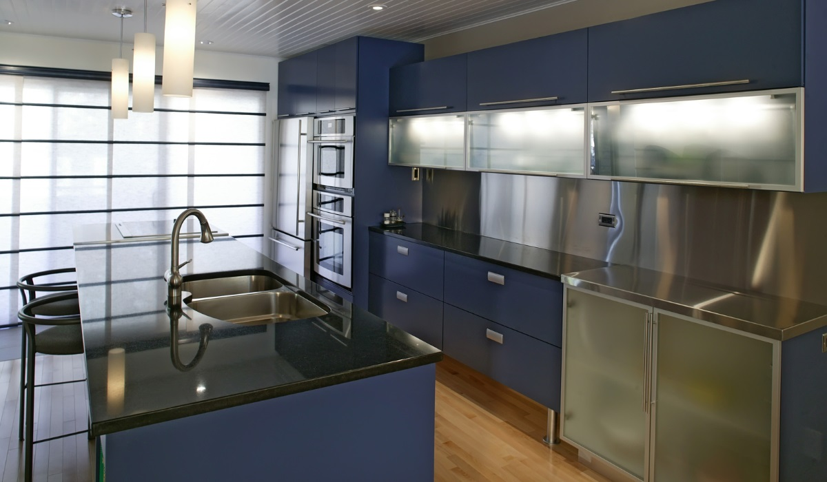 Modern kitchen in dark blue and steel finish 