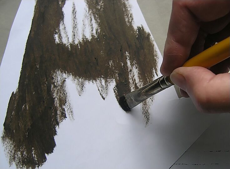 An artist uses the oil transfer method. Note, no medium has been added to the oil colour here.