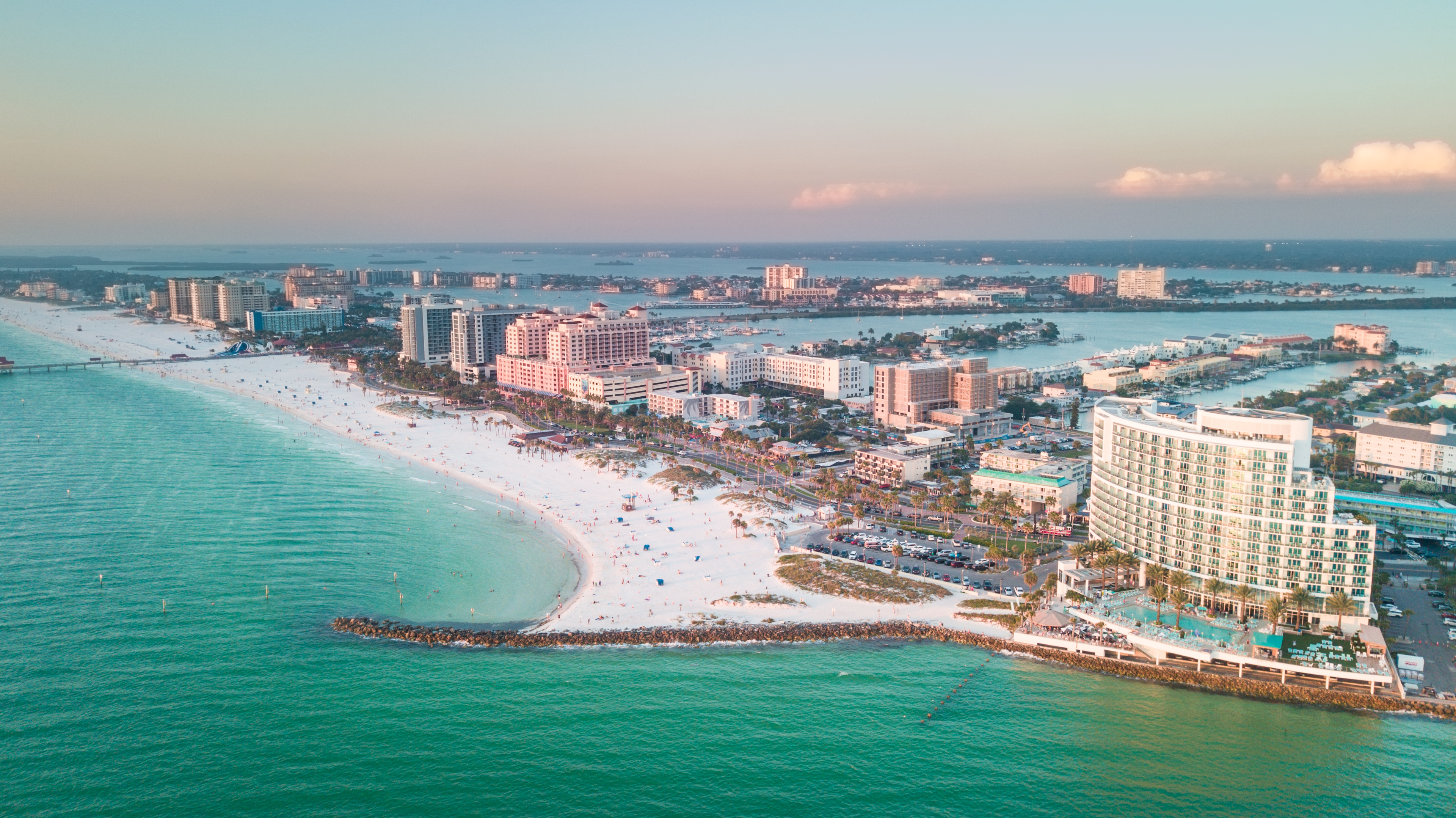 Aerial view of Clearwater Beach coastline with beach hotels, blue water and a morning sky  