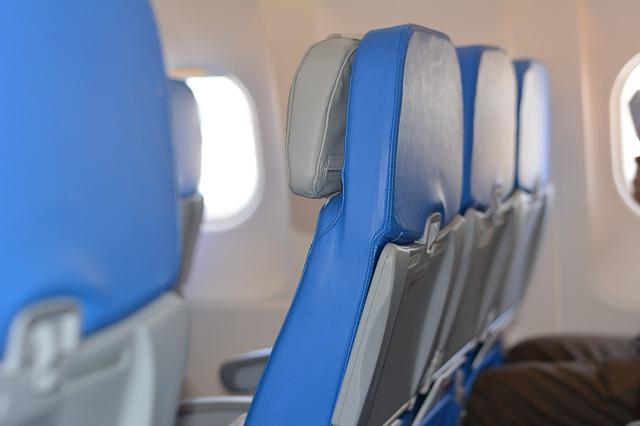 Types of flights: Economy class cabin seats in an aircraft.