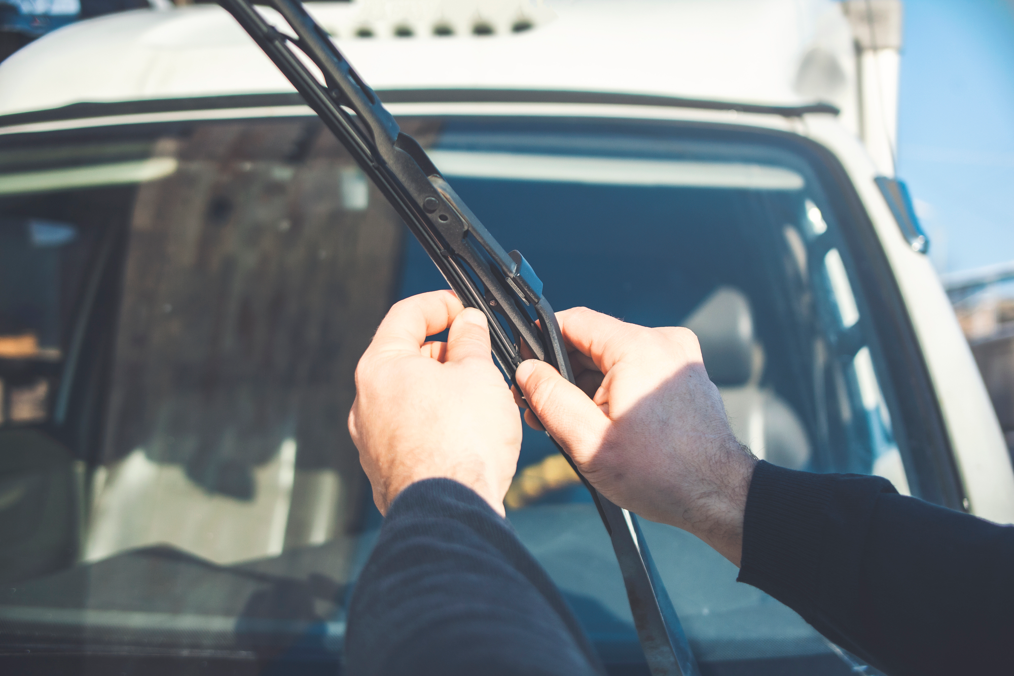 Technician replacing worn wipers