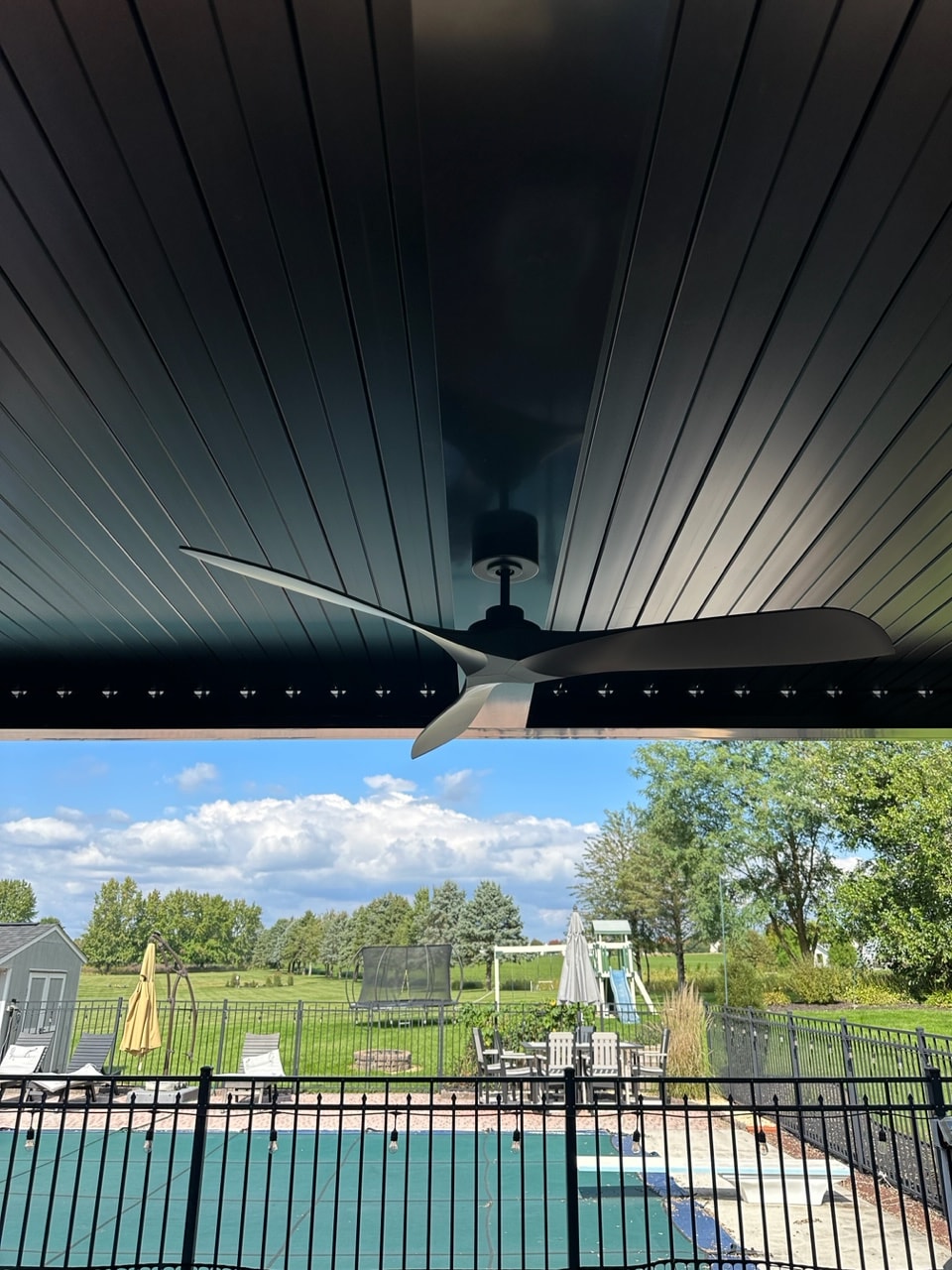 cieling fan underneath closed roof pergola structure