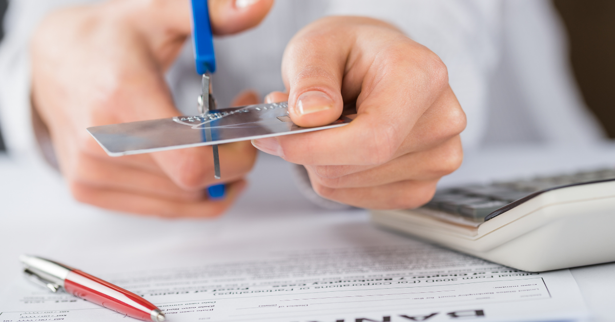 Image of a person cutting credit card to symbolize the effects of bankruptcy