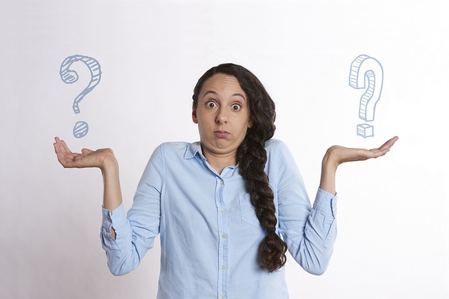 Image of woman unable to decide between two choices. Choosing the right PIM software for your organization can be difficult.