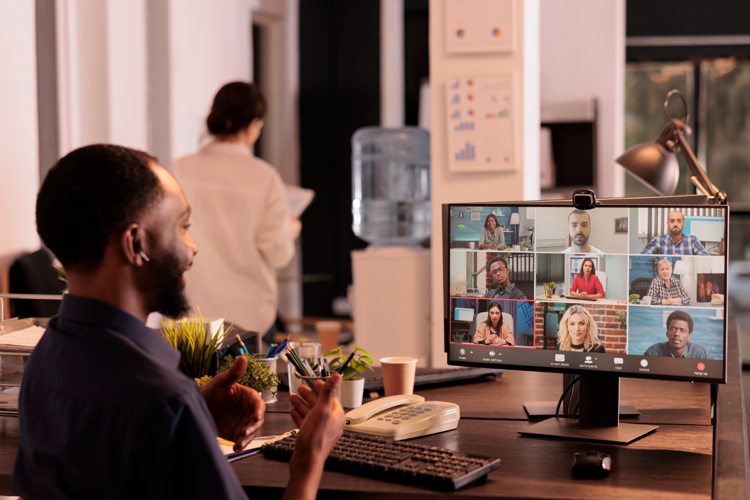 A diverse team of remote professionals from different countries collaborating over video call.