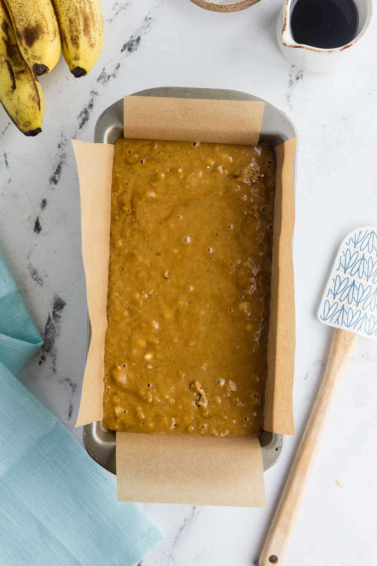 banana gingerbread batter in loaf pan