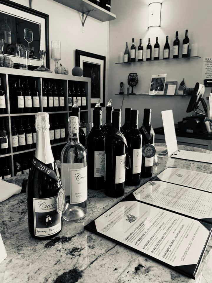 Bottles lined up on a table in a tasting room