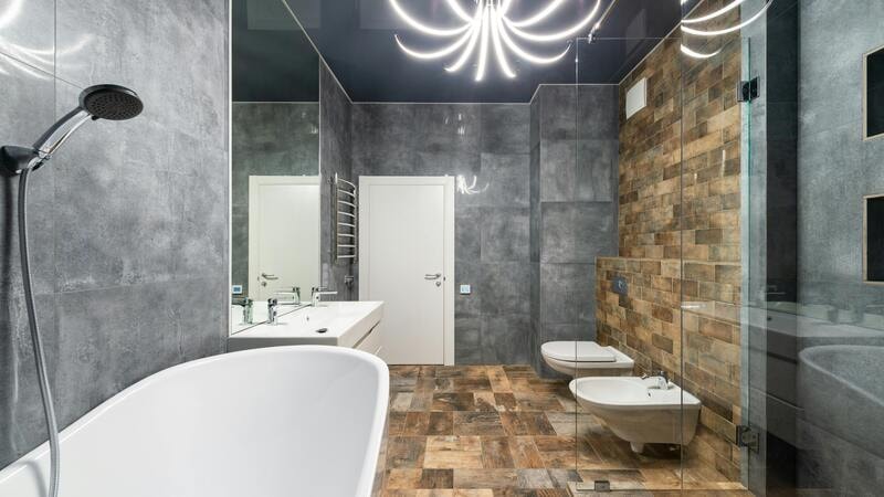 Chandelier placed at the center of bathroom