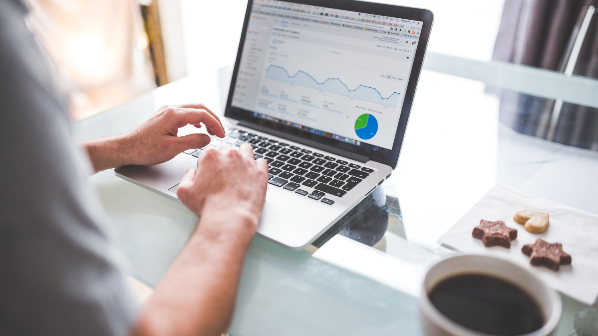 A person looking at a laptop with a portfolio of stocks