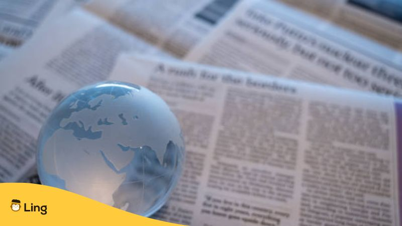 Glass globe on newspapers