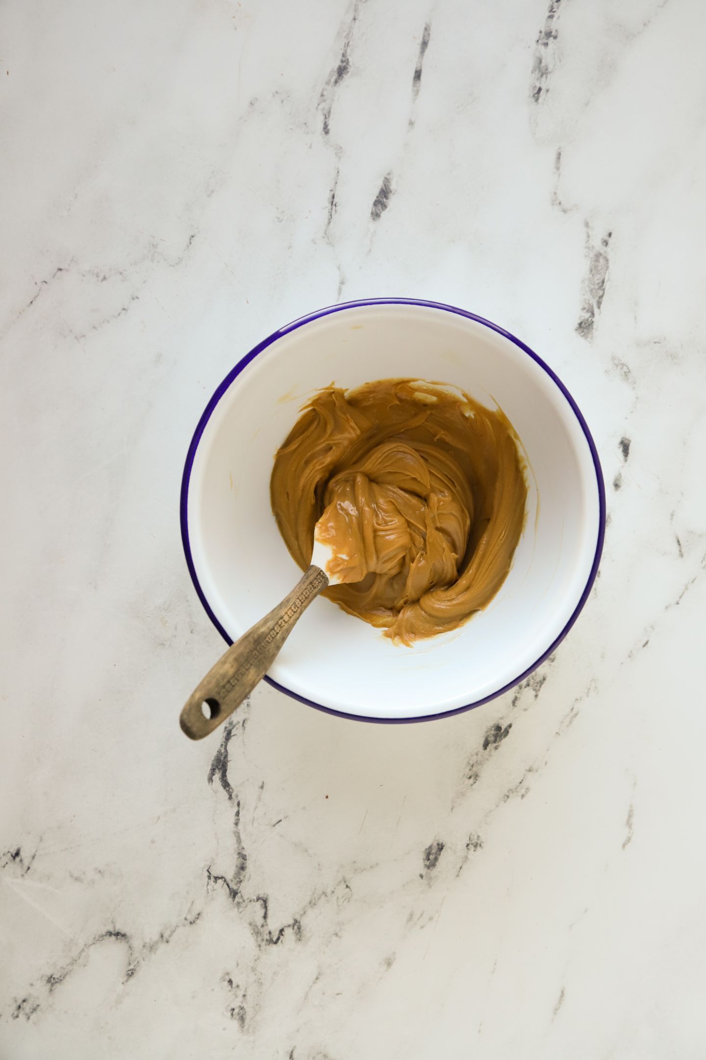 creamy peanut butter filling in a bowl with a rubber spatula