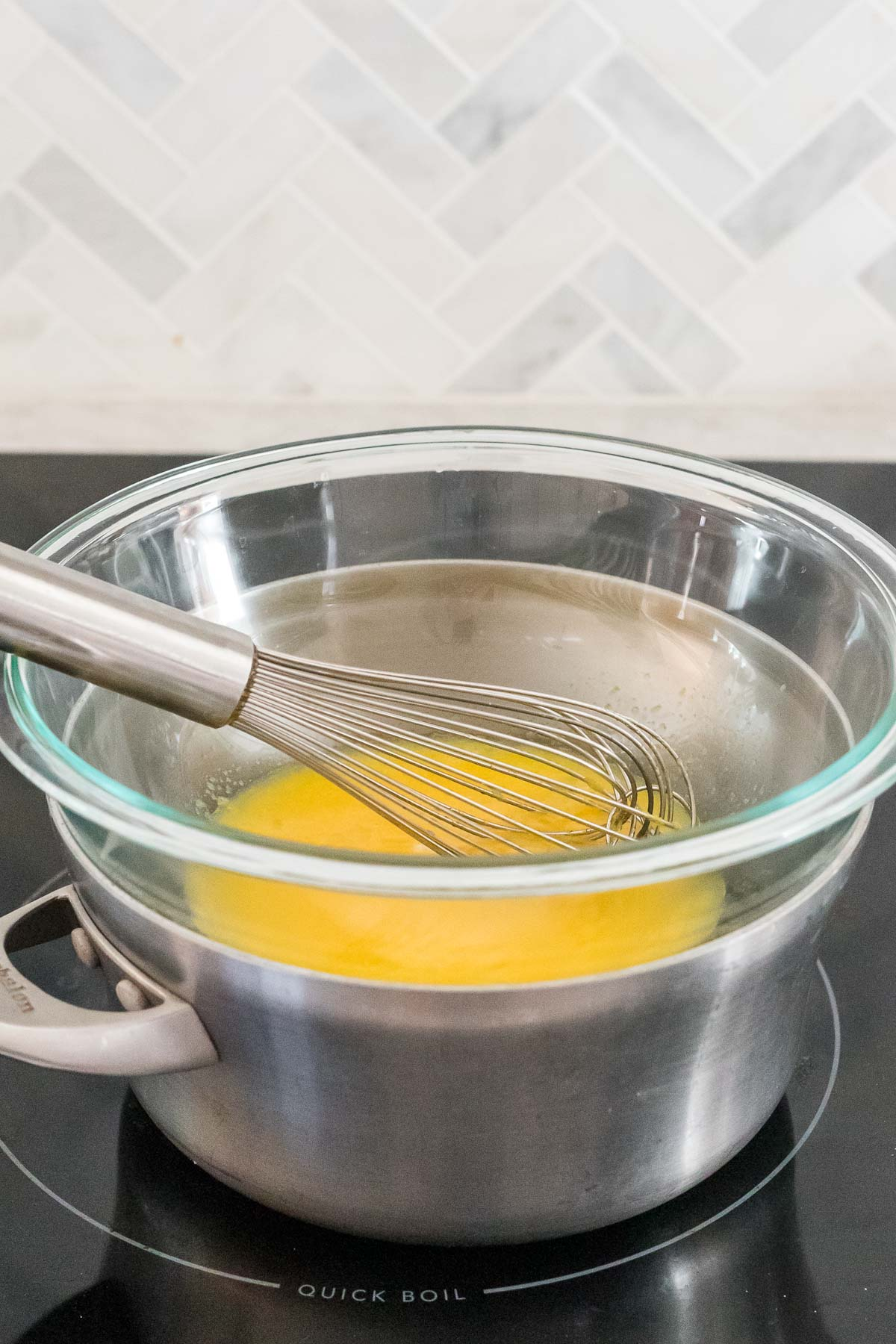 lemon curd ingredients in double boiler 