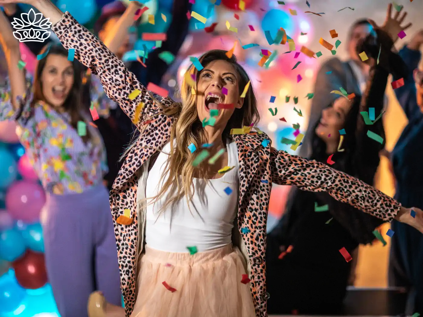 A joyful party scene with confetti and a woman celebrating energetically - Fabulous Flowers and Gifts.