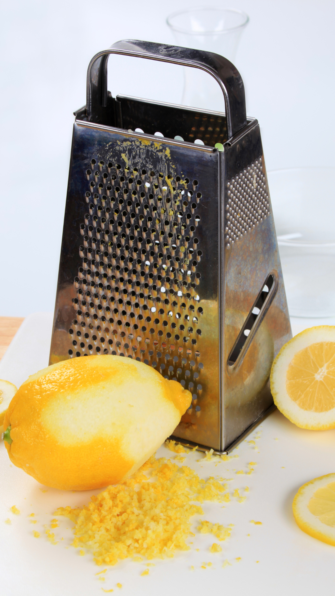 box grater and a lemon being zested