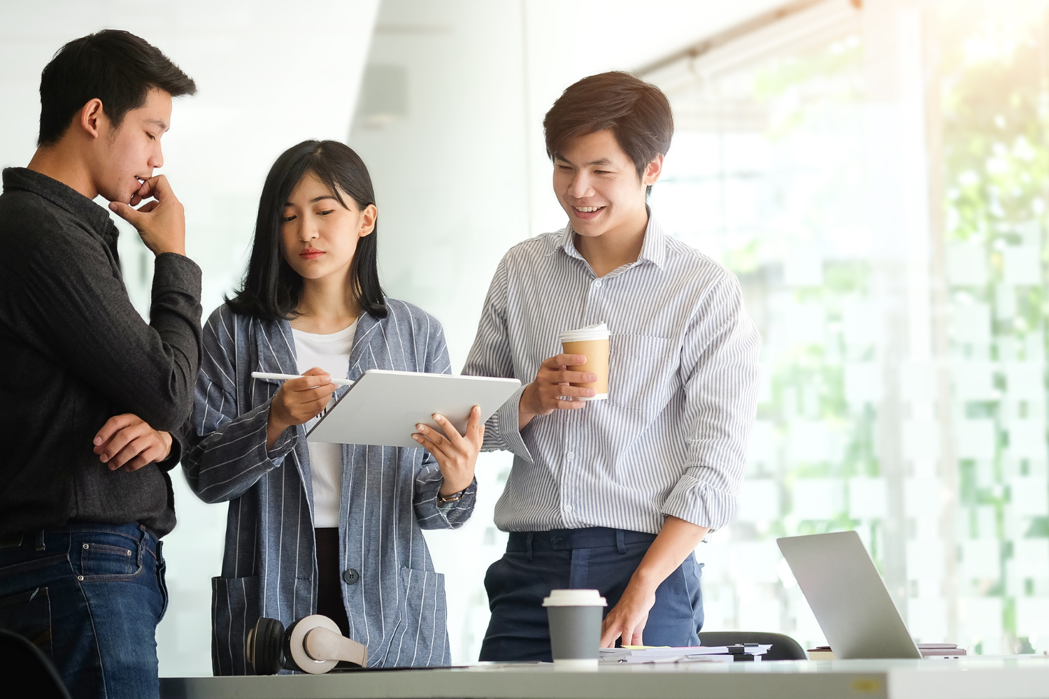 A team of office workers, collaborating effectively in an office setting.