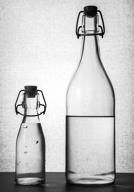 An image of two glass water bottles.