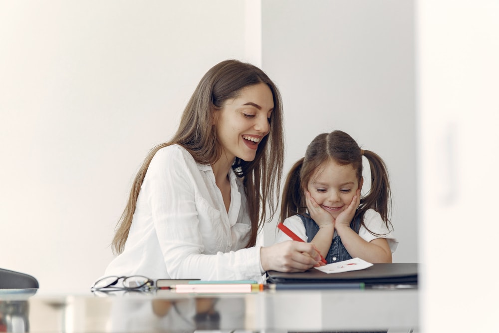 woman as tutor teaching a schoolgirl