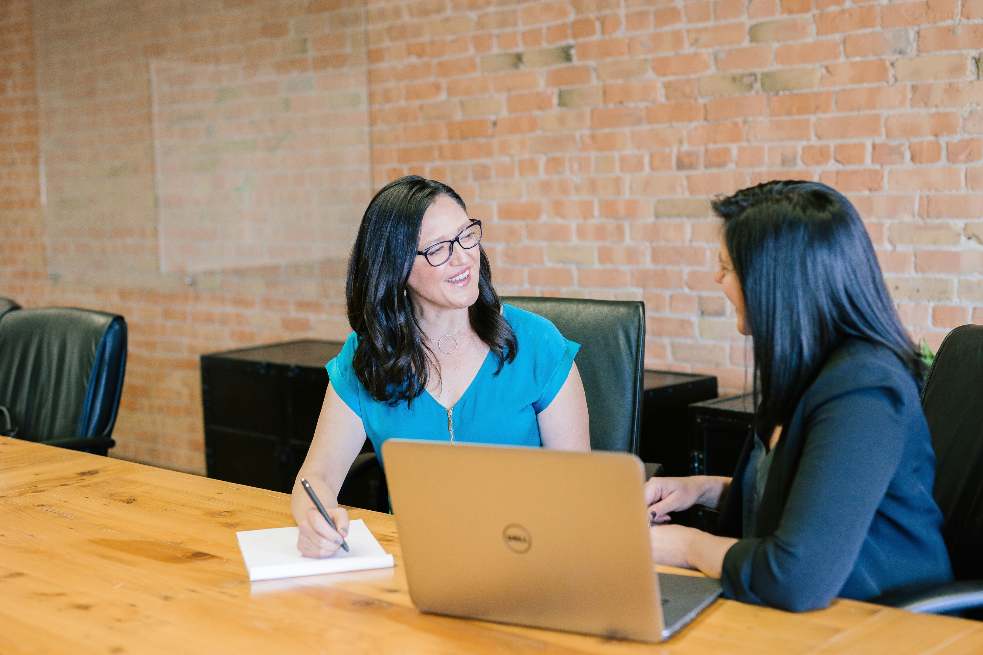 Real estate investment pair meets to discuss their lead generation system. 