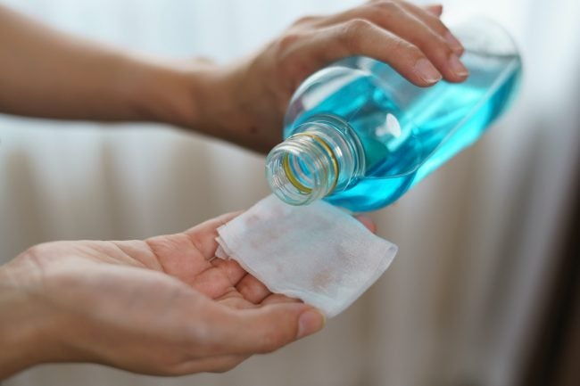 Remove the stains using the cotton pad with rubbing alcohol