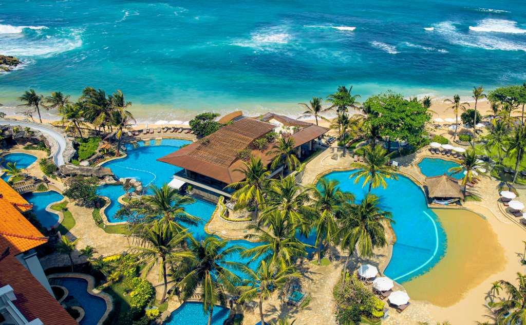 Swimming pools beside the sea at the Hilton Bali Resort, Bali, Indonesia