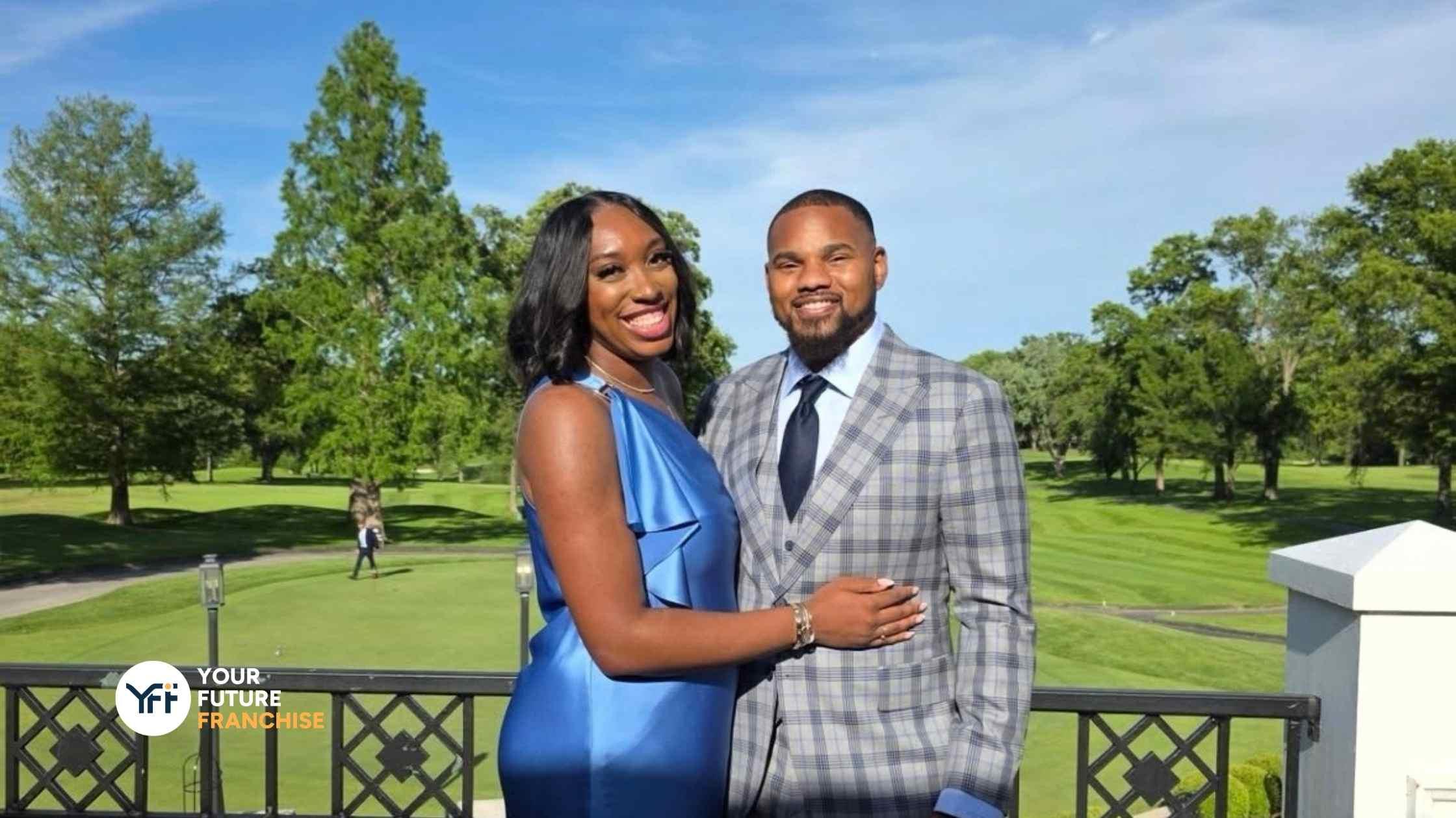 Malik and Cece Reed together at a golf day function