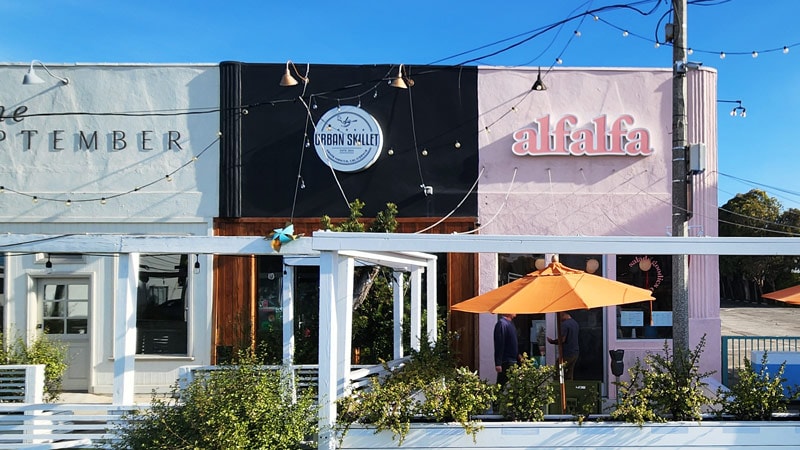 Row of storefront signs including alfalfa channel letter sign in Santa Monica.