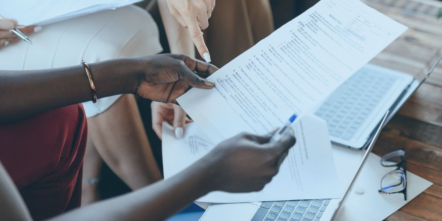 Women checking out a document for disaster recovery planning