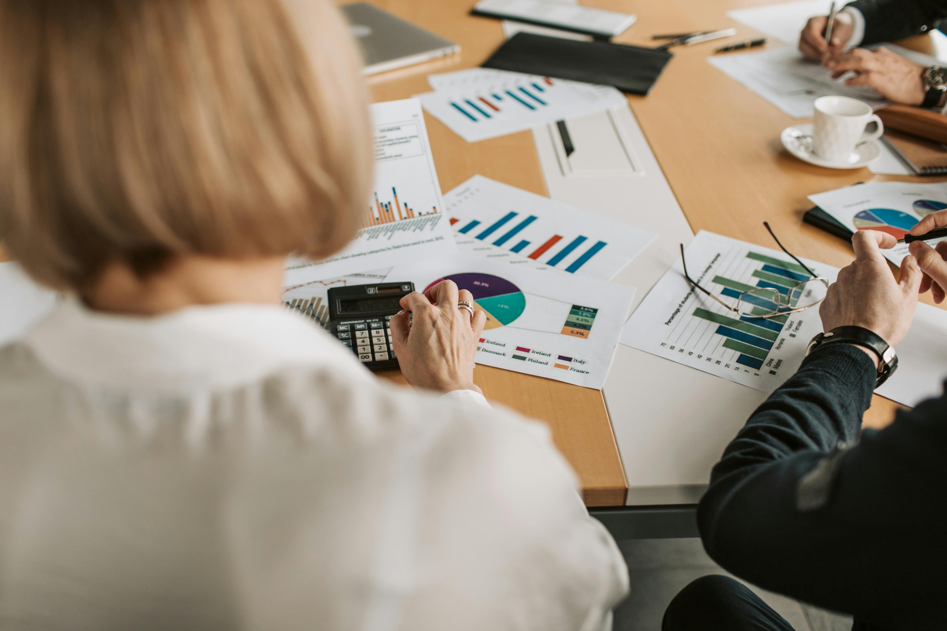 Woman looking at different financial data and statistics