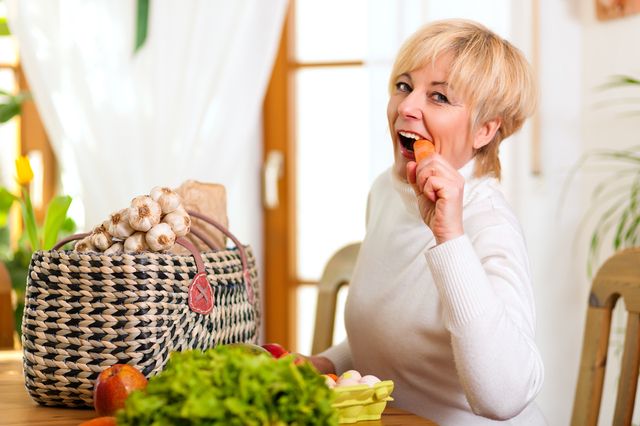 A person eating a plate of organic food