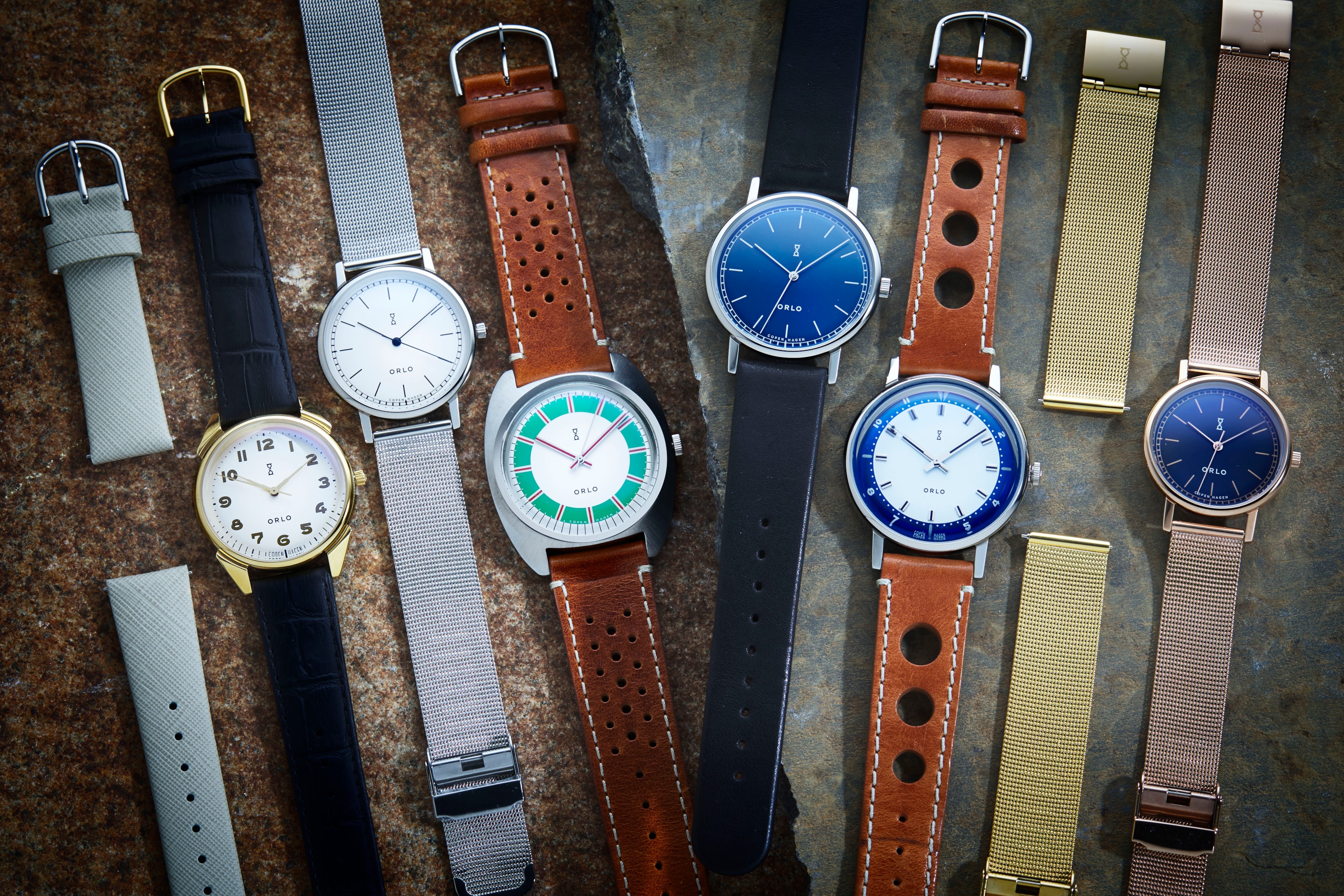 A collection of ORLO Watches' interchangeable watches featuring various styles and colors.