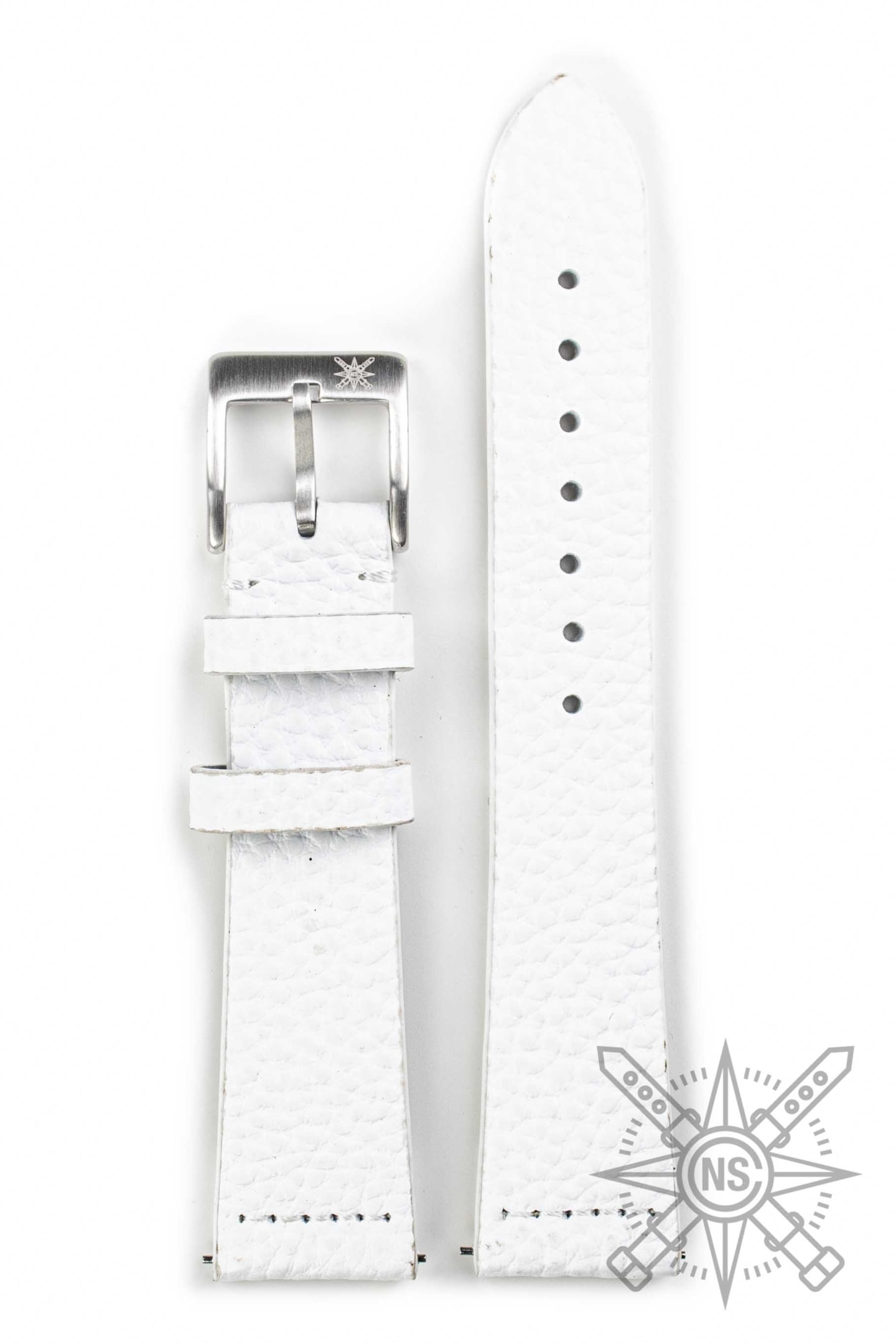 A stylish person wearing a white leather watch strap that complements their outfit.