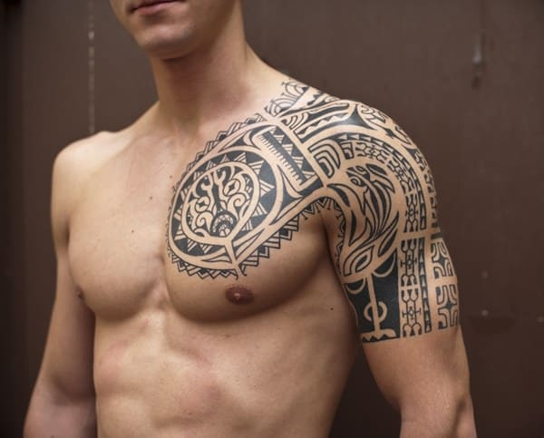 Source: http://www.fashionfoody.com/style/tribal-tattoos-why-are-they-so-popular/    Caption: Chest tattoos with Tribal design