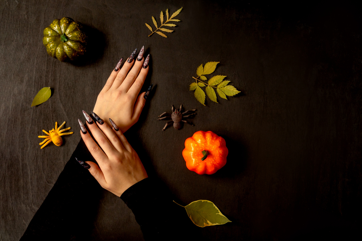 A stylish illustration of classic black Halloween nails.