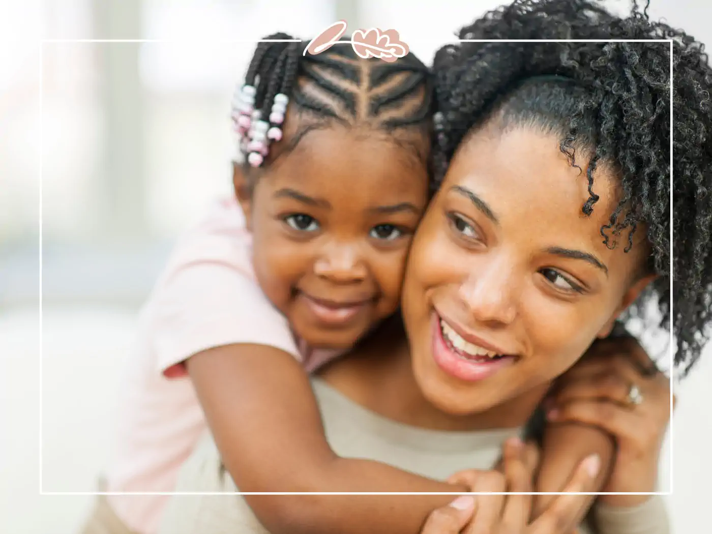 Mother and daughter smiling and hugging indoors, fabulous flowers and gifts