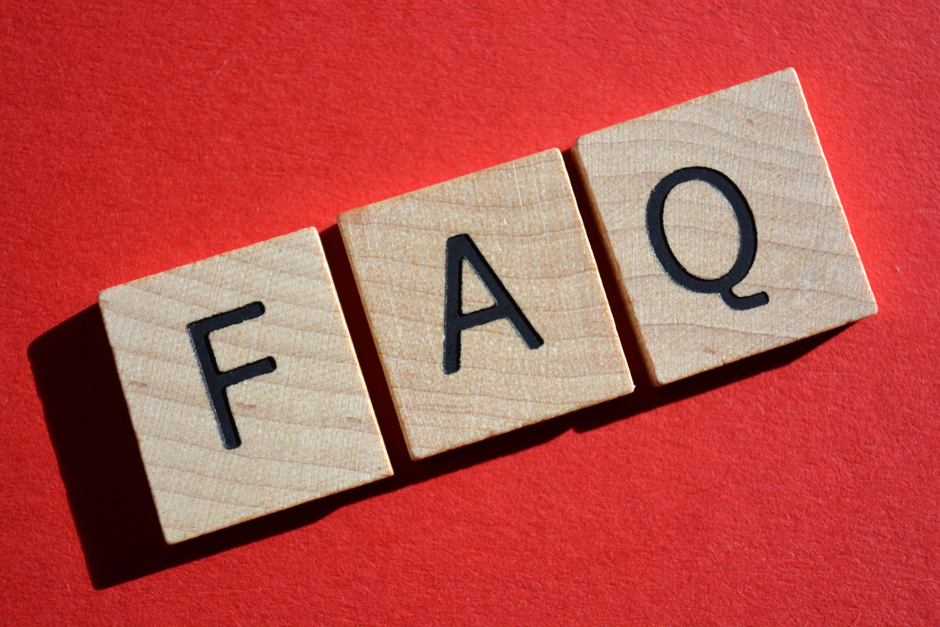 "'FAQ' spelled boldly in 3D letters against a red backdrop – your gateway to unraveling California Employment Law and HR topics through the most commonly asked questions."
