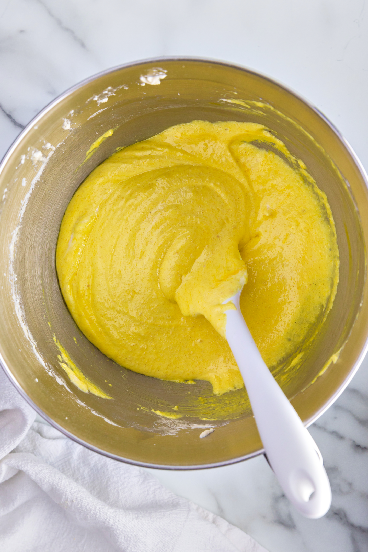 yellow macaronage mixture in bowl