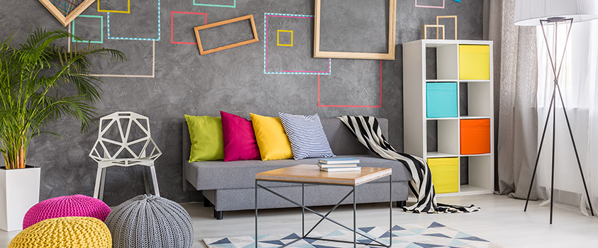 A modern style living room full of bright colours, abstract furniture and frames, and an Artiss Tria short pile rug.
