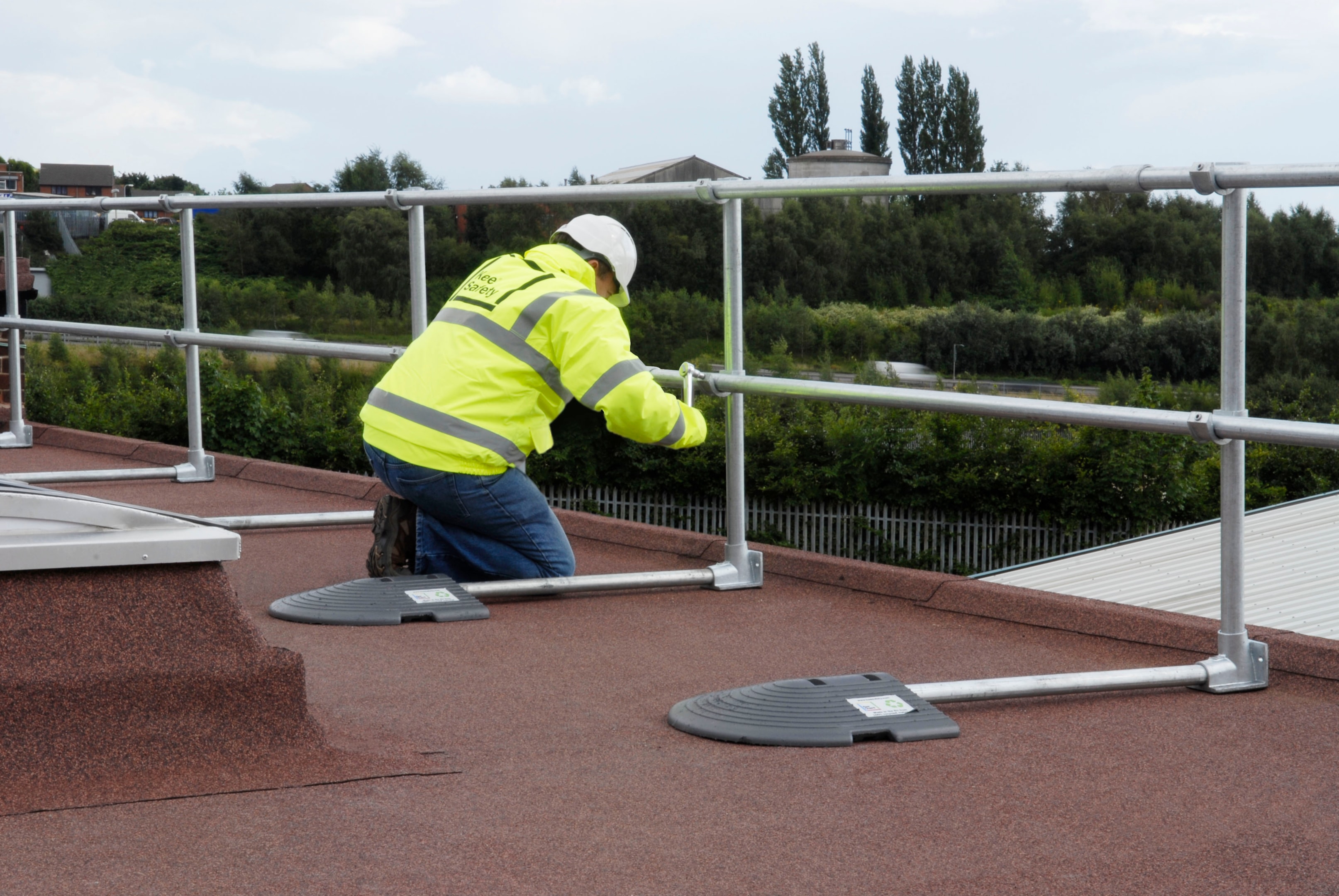 How to Ensure Rooftop Safety Compliance in 2025 1 Workers accessing rooftop safely using Kee Guard® guardrails for Rooftop Safety Compliance