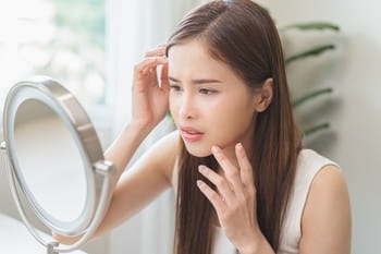symptoms of heat rash