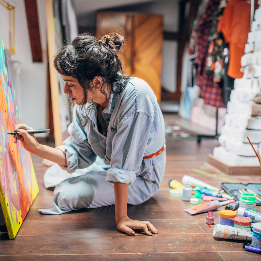 artist in a studio painting