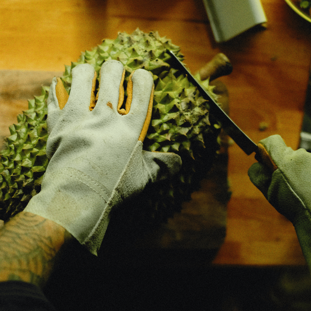 A person wearing cut resistant gloves for knuckle protection