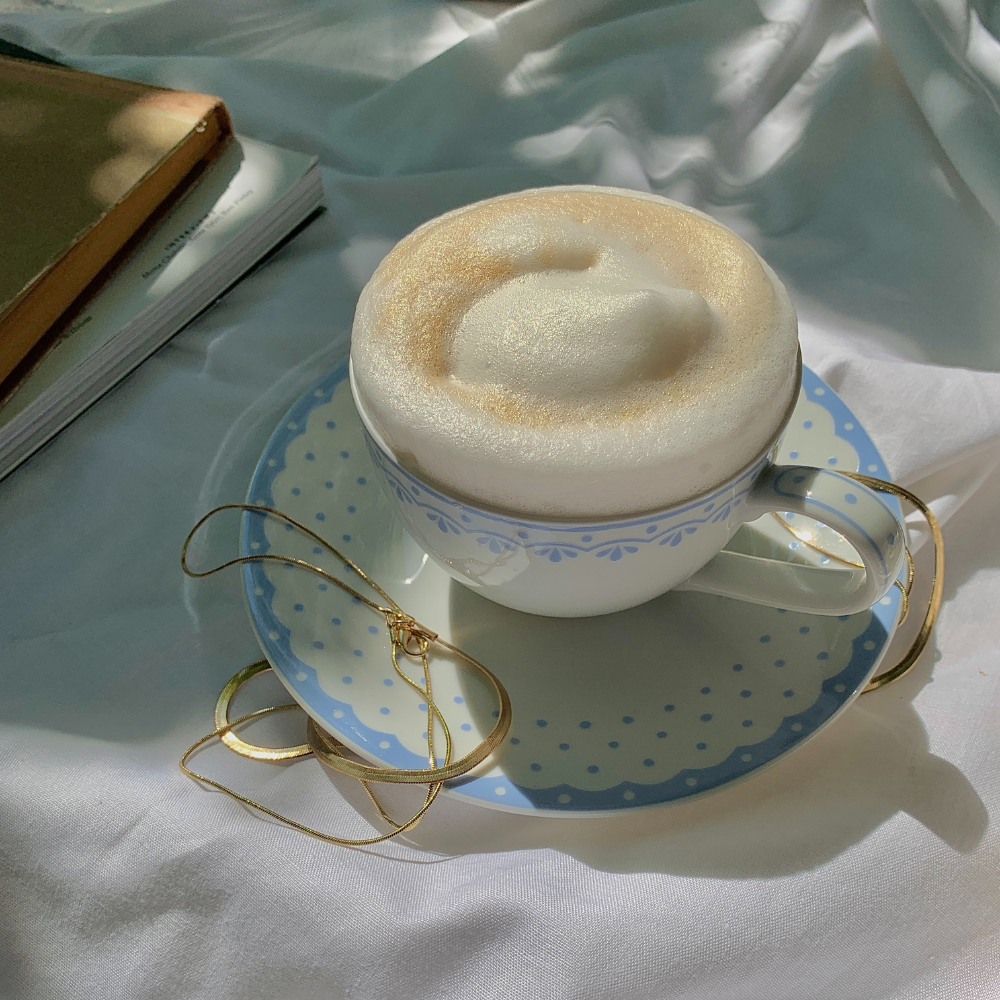 A cup of coffee with a thick and creamy milk foam