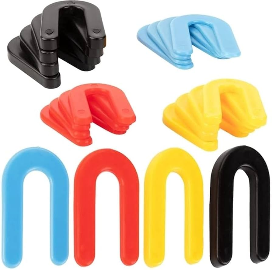 Various plastic horseshoe shims in different colors