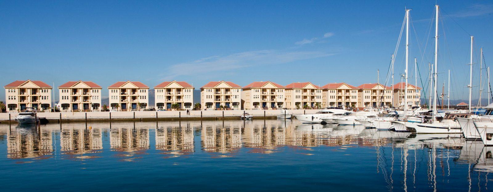 Category 2 Gibraltar marina lifestyle showing luxury waterfront apartments and yachts, highlighting tax-efficient relocation for UK expats and high-net-worth individuals.