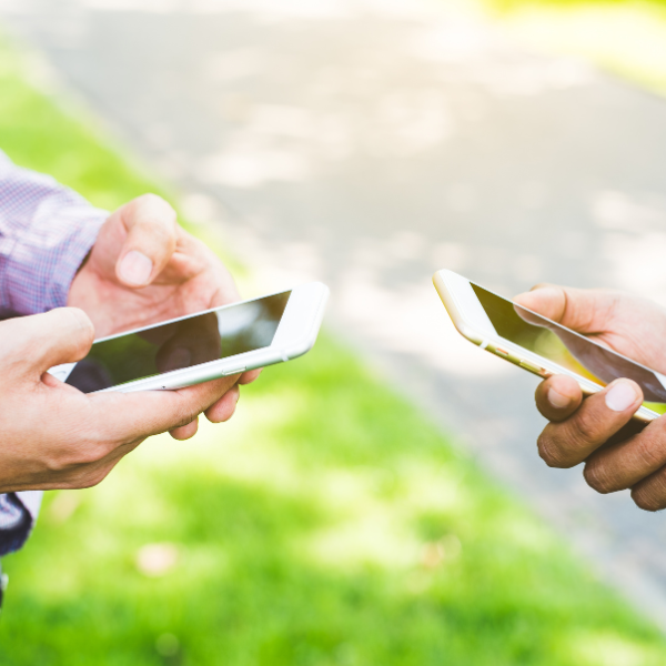 An image showing people exchanging contact information.
