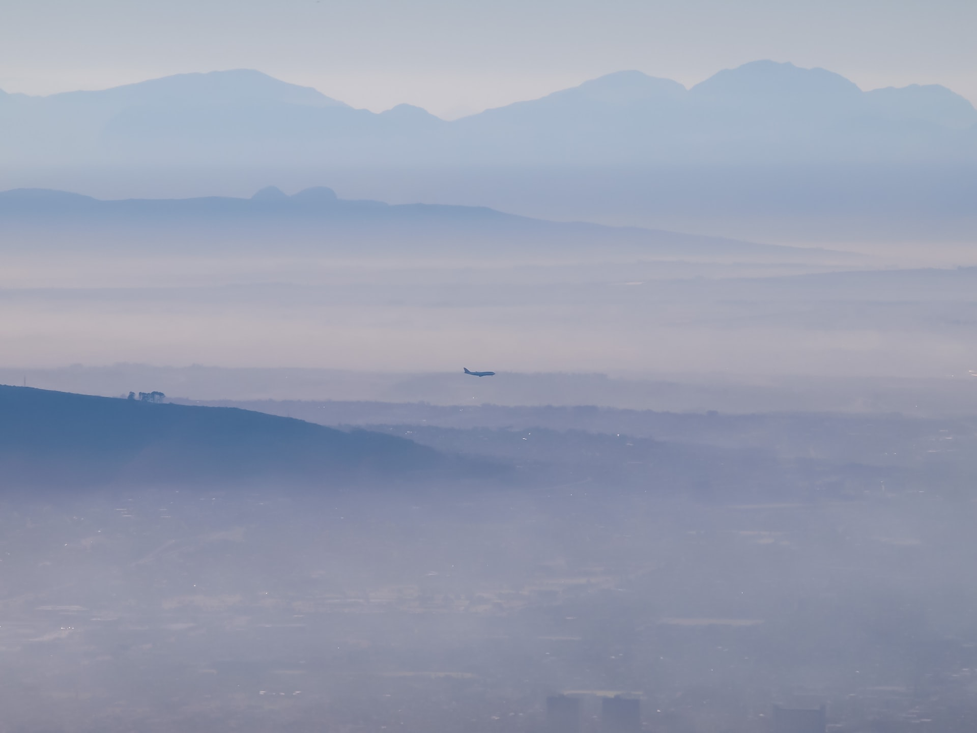 An aircraft flying through upslope fog.