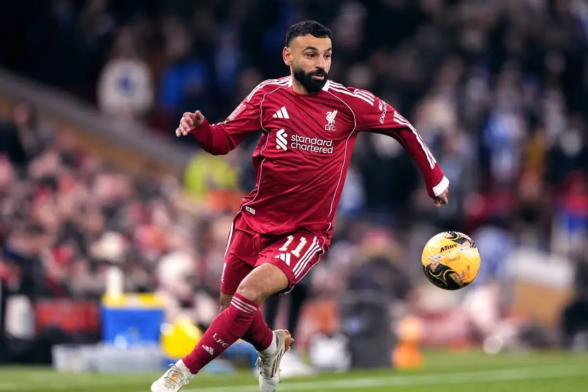 Mohamed Salah dribbles the ball for Liverpool during an English Premier League match