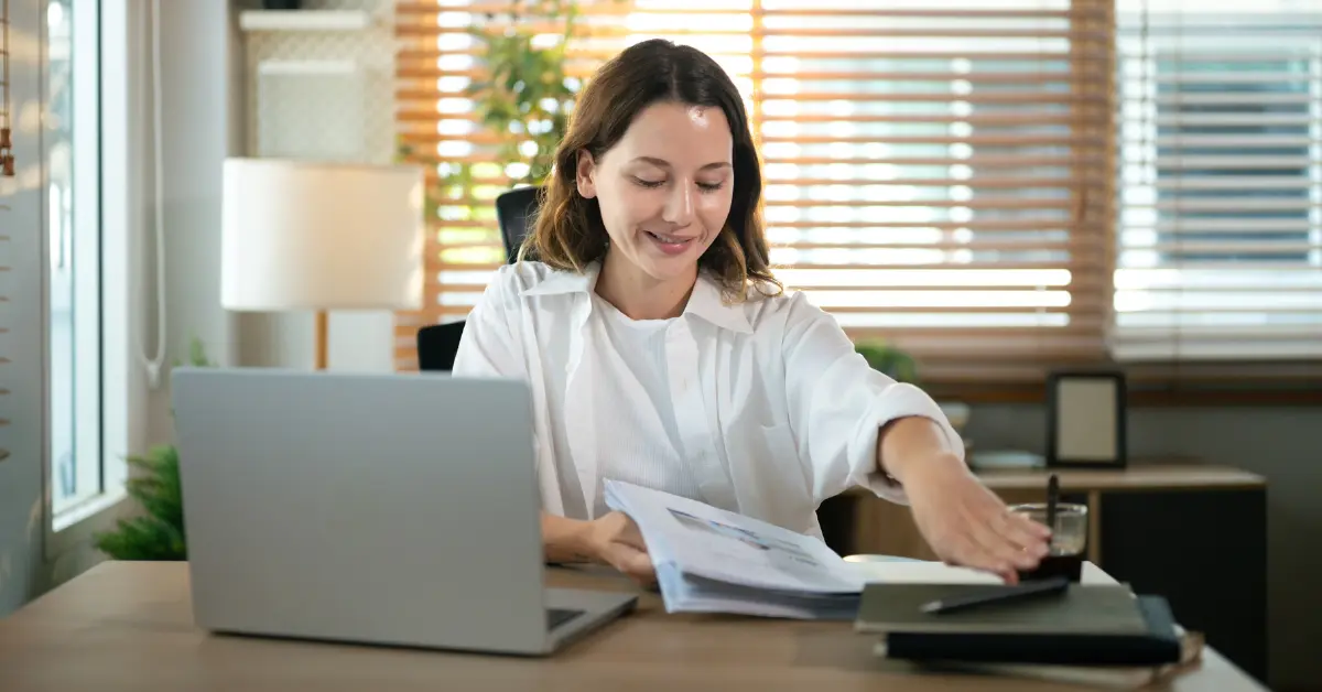 OnlyFans creator reviewing LLC paperwork and researching the cheapest way to form an llc for her business.