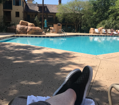Taking a break by the pool near our room at Coronado Springs resort.